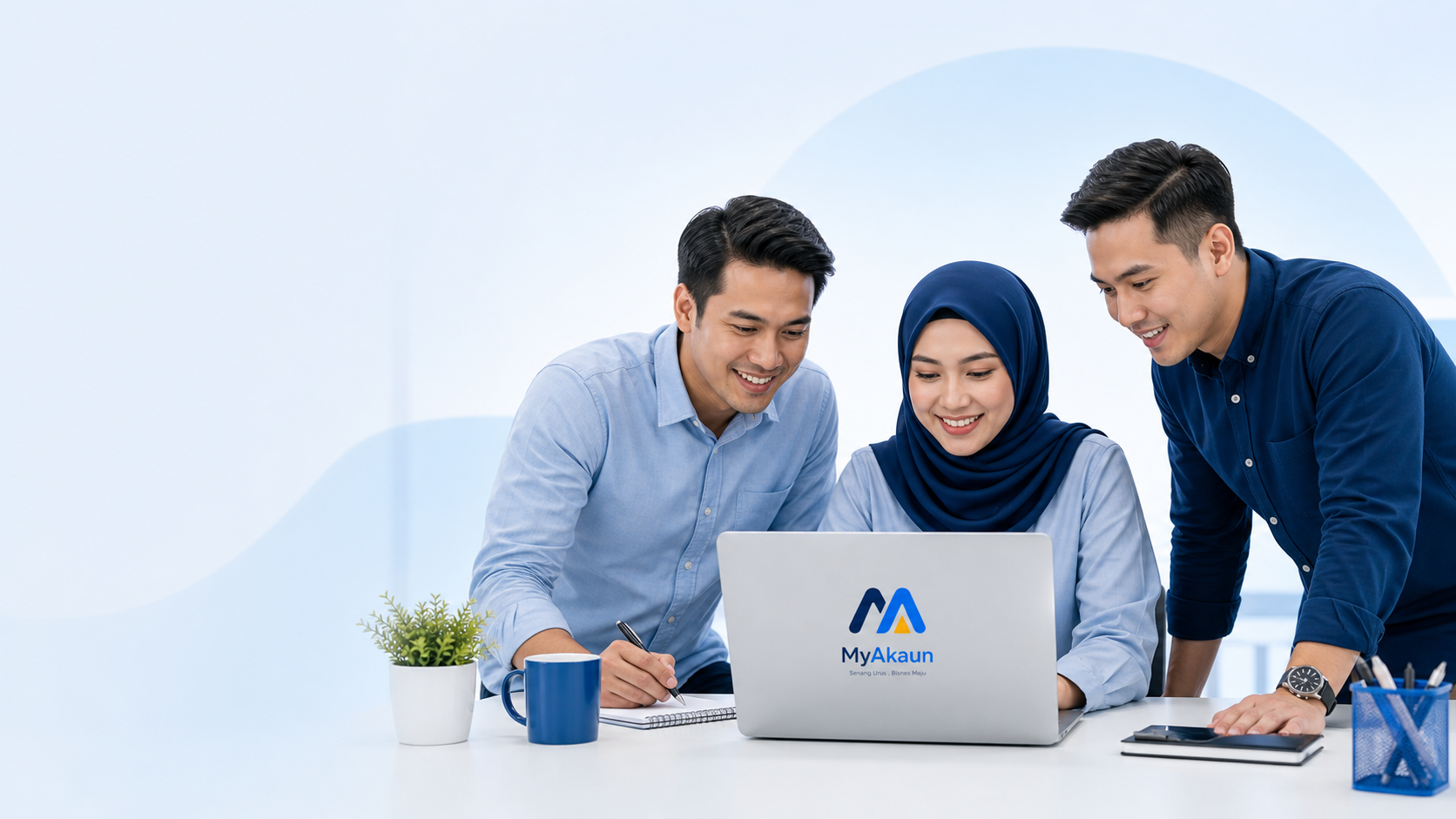 MyAkaun team using laptop